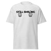 T-Shirt Classic - Still Smiling black ein Produkt von SCHIETKRAM