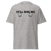 T-Shirt Classic - Still Smiling black ein Produkt von SCHIETKRAM
