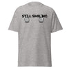 T-Shirt Classic - Still Smiling black Sport Grey ein Produkt von SCHIETKRAM
