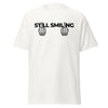 T-Shirt Classic - Still Smiling black White ein Produkt von SCHIETKRAM